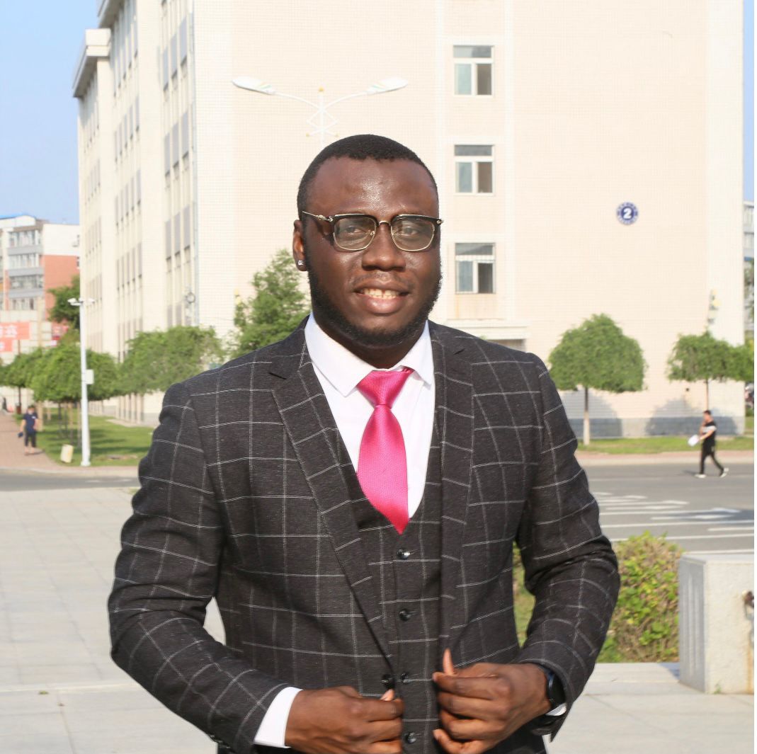 Ebuka Philip Oguchi standing in front of a university building